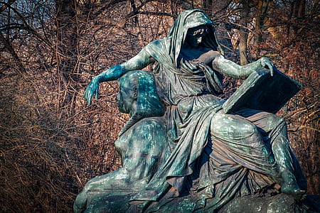 woman sitting holding book statue thumbnail
