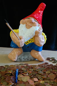 dwarf ceramic figurine beside coin lot thumbnail