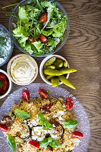 variety of vegetable and cooked food on plates and bowls thumbnail