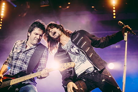 two man singing on stage thumbnail