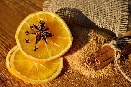 sliced orange fruit on brown surface thumbnail