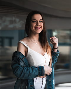 selective focus photography of woman wearing white tank top thumbnail