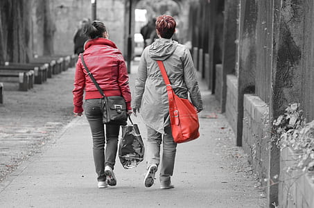 two women walking on street thumbnail