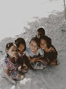 Five Toddlers Sitting on Sand thumbnail
