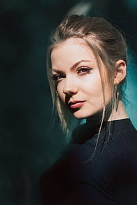 blonde woman wearing black crew-neck sweater thumbnail