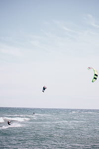 Surfboarding with surfing kite in the ocean thumbnail