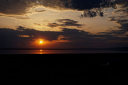 calm body of water during sundown thumbnail