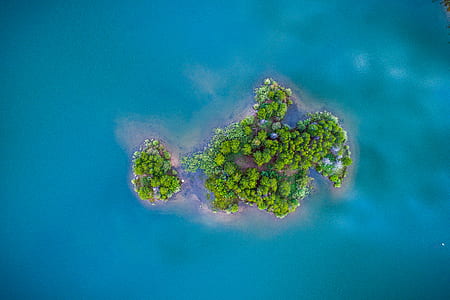 aerial photography of island surrounded by water at daytime thumbnail