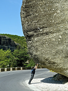 man holding rock formation thumbnail