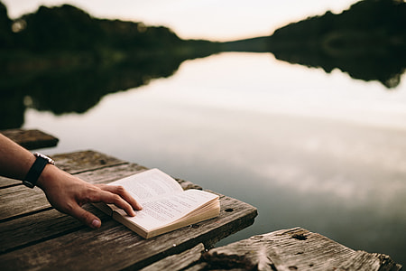 Reading book at lake thumbnail