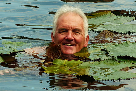 man smiling while in swamp thumbnail
