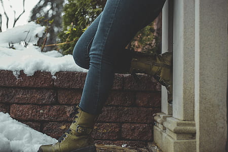 woman in black jeans and pair of leather boots thumbnail