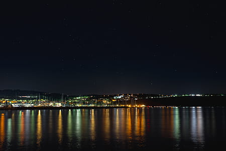 Starry sky at night over the marina, Izola, Slovenia thumbnail