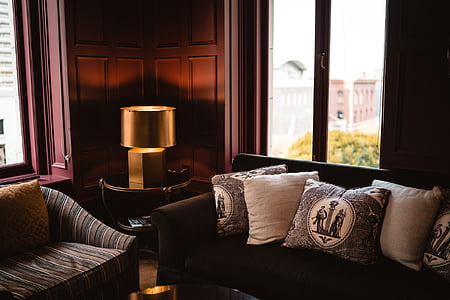 brown fabric sofa with throw pillows thumbnail