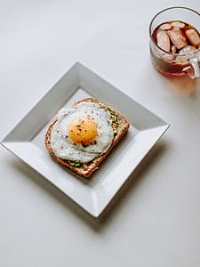 sunny side-up egg on white plate thumbnail