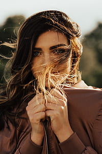 woman in brown zip-up jacket thumbnail