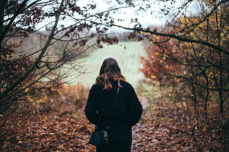 woman standing in forest thumbnail