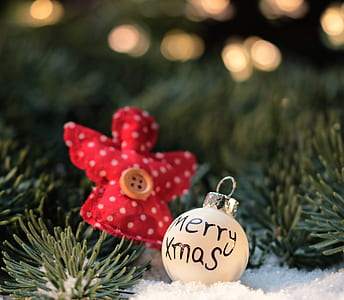 closeup photo of white Merry Xmass bauble thumbnail