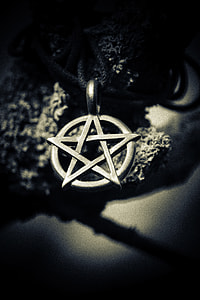 grayscale depth of field photography of star pendant thumbnail