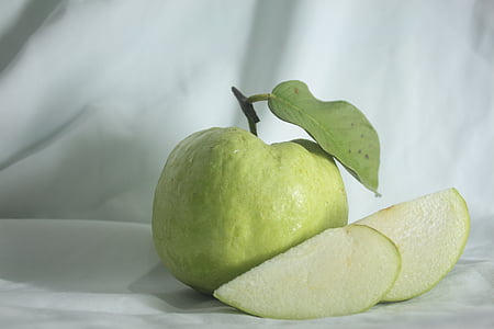 sliced green fruit on white surface thumbnail