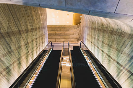black and gray escalator inside the building thumbnail