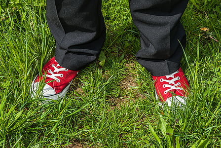 person standing on grass during daytime thumbnail