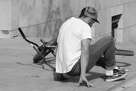 man near fallen bicycle thumbnail