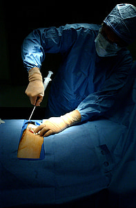 surgeon performing surgery on patient's body thumbnail