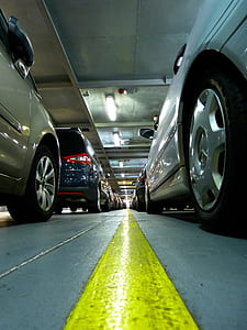 low angle photo of vehicles parked inside parking lot thumbnail