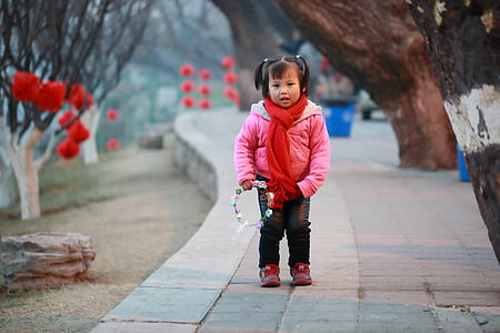 girl standing near tree thumbnail