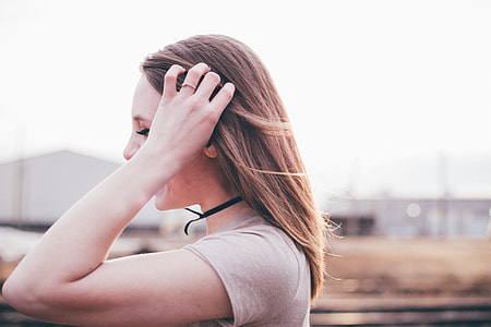woman holding her hair thumbnail