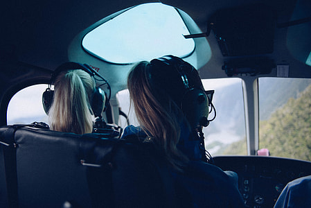 two women riding on helicopter thumbnail