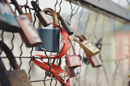 Lovelock Bridge padlock with red ribbon in closeup shot thumbnail