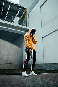 man standing near building thumbnail