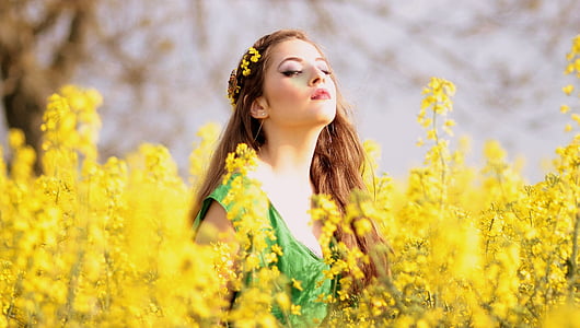 selective focus photography of woman wearing green top thumbnail