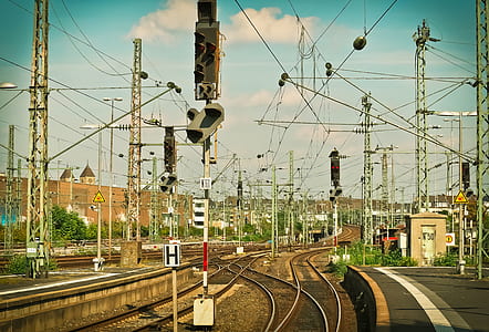 electricity poles beside railroad thumbnail