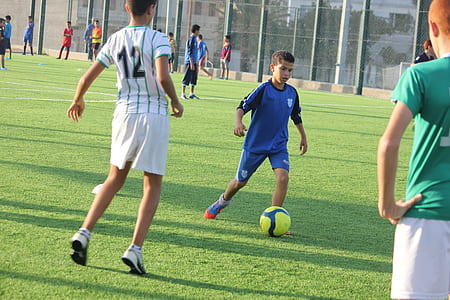 group of kids playing soccer thumbnail