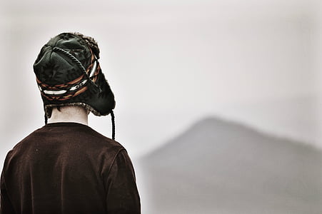 shallow focus photography of man facing mountain thumbnail
