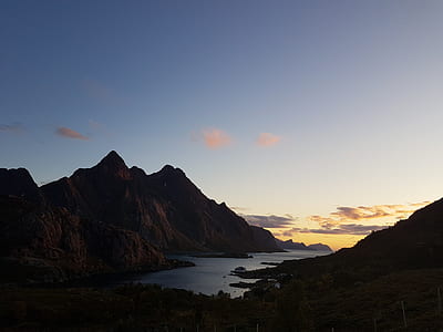 mountains near body of water thumbnail