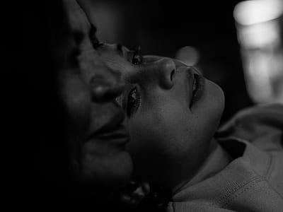grayscale photo of woman and child thumbnail