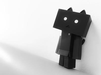 black metal character near white painted wall thumbnail
