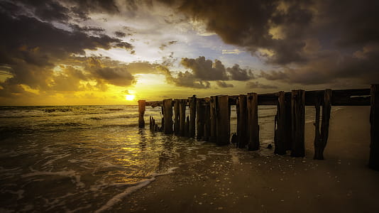 Brown Wooden Dock Overlooking Sunset thumbnail