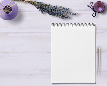 white notebook with gray ballpoint pen thumbnail