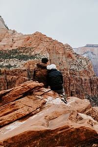 Couple Sitting on Rock Cliff thumbnail
