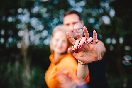 Young couple holding hands outdoors thumbnail