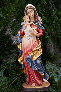 woman carrying baby religious figurine thumbnail