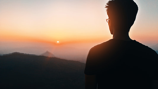 man standing on top of the mountain thumbnail