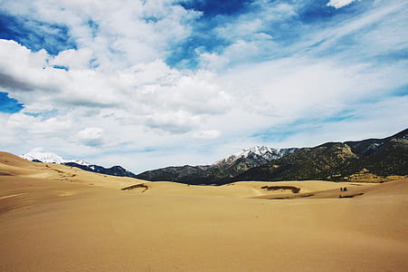 brown desert near mountain thumbnail