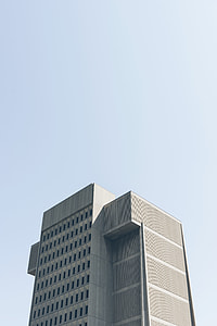 photo of gray high rise building under cloudy sky thumbnail