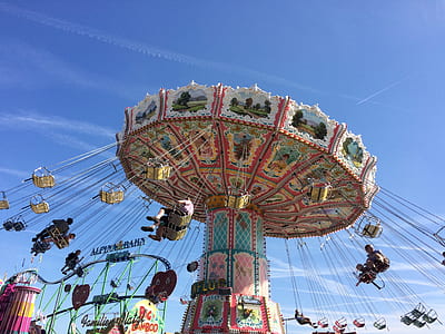 people riding on carnival ride thumbnail